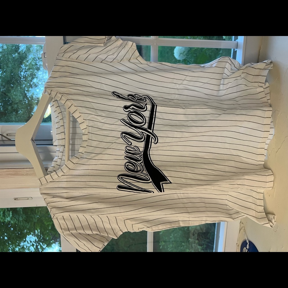 White with black stripes shirt. Label New York.